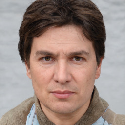 Joyful white adult male with short  brown hair and grey eyes