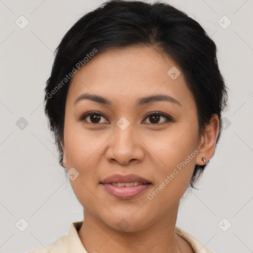 Joyful latino young-adult female with medium  brown hair and brown eyes