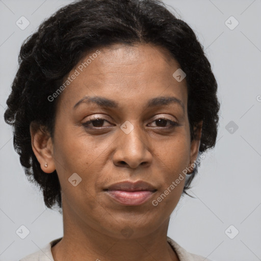 Joyful black adult female with short  brown hair and brown eyes