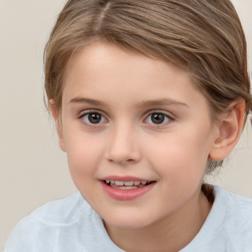 Joyful white child female with medium  brown hair and brown eyes