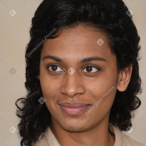 Joyful black young-adult female with medium  brown hair and brown eyes