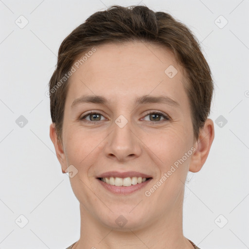 Joyful white young-adult female with short  brown hair and grey eyes