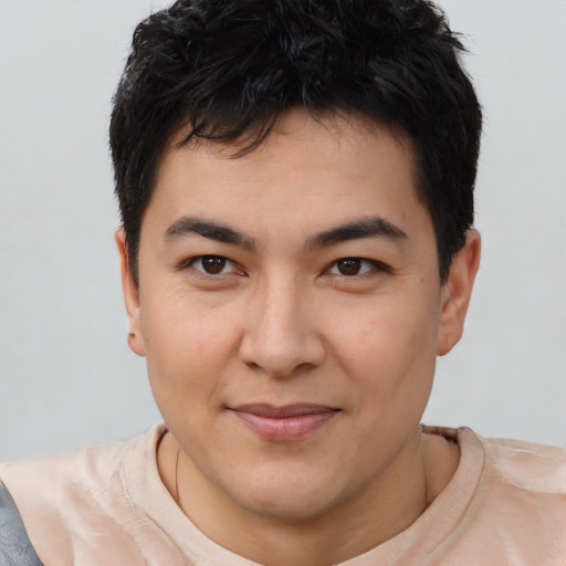 Joyful asian young-adult male with short  brown hair and brown eyes