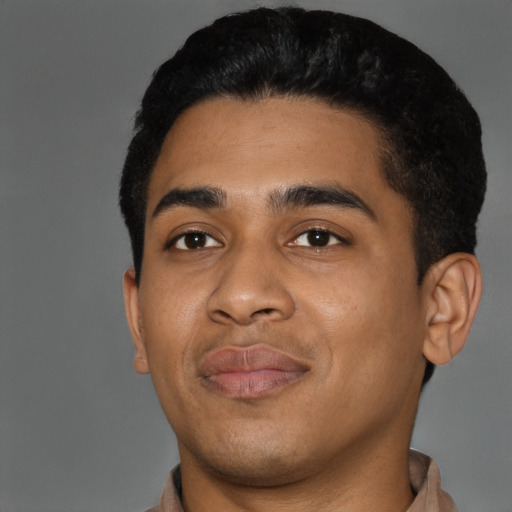 Joyful latino young-adult male with short  black hair and brown eyes