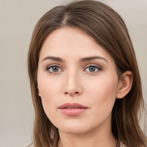 Neutral white young-adult female with long  brown hair and brown eyes