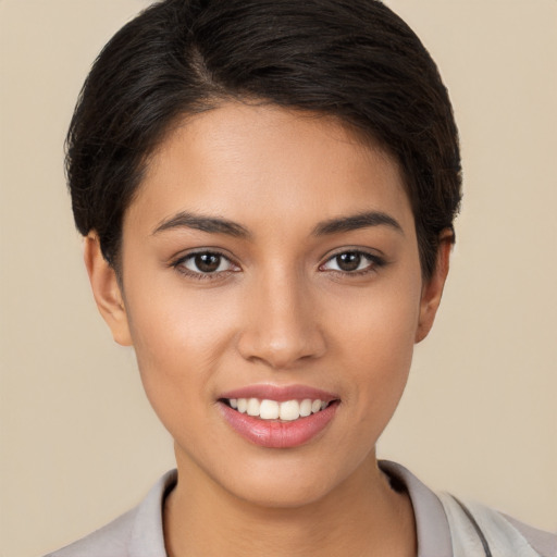 Joyful white young-adult female with short  brown hair and brown eyes