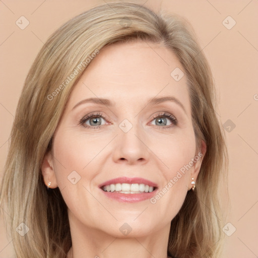 Joyful white adult female with medium  brown hair and grey eyes