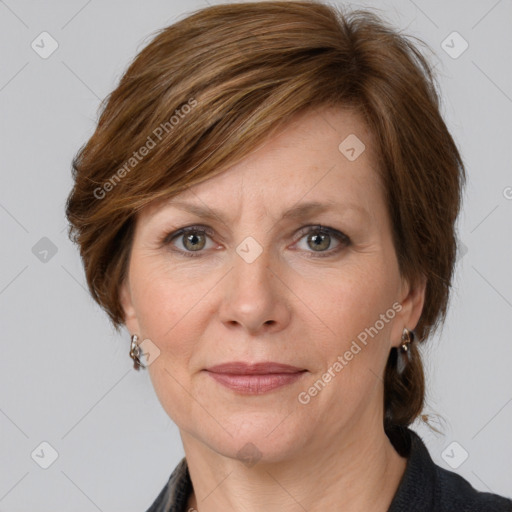 Joyful white adult female with medium  brown hair and grey eyes