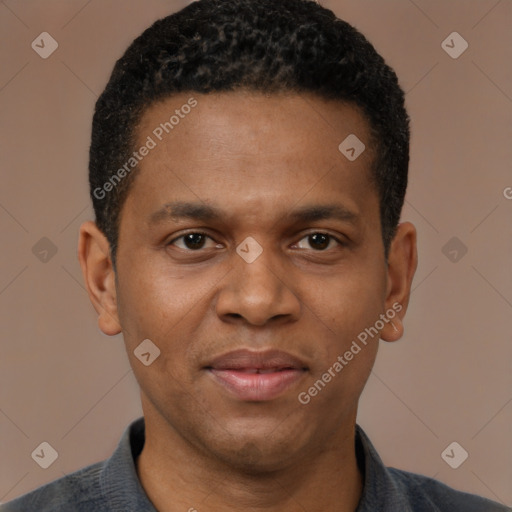 Joyful black young-adult male with short  brown hair and brown eyes