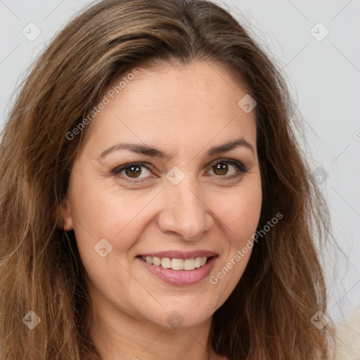 Joyful white adult female with long  brown hair and brown eyes