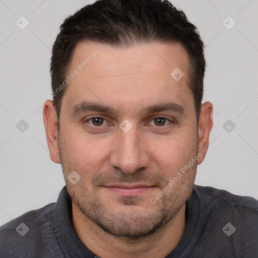 Joyful white adult male with short  brown hair and brown eyes