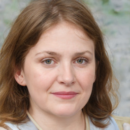 Joyful white young-adult female with medium  brown hair and blue eyes