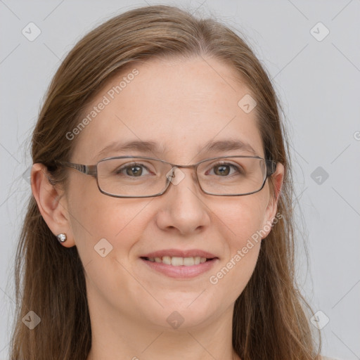 Joyful white adult female with long  brown hair and grey eyes