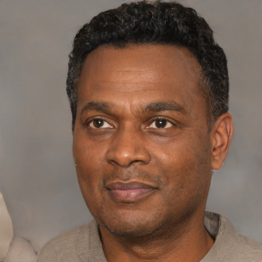 Neutral latino adult male with short  black hair and brown eyes