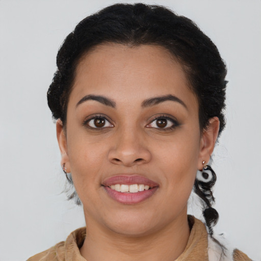 Joyful latino young-adult female with medium  brown hair and brown eyes