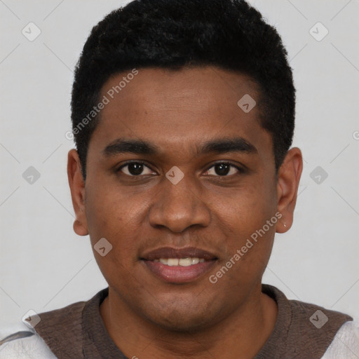 Joyful black young-adult male with short  black hair and brown eyes