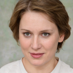 Joyful white young-adult female with medium  brown hair and green eyes