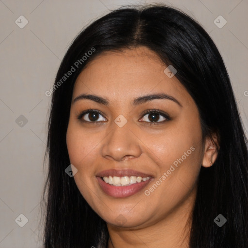 Joyful latino young-adult female with long  brown hair and brown eyes