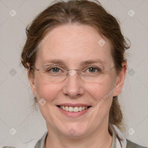 Joyful white adult female with medium  brown hair and blue eyes