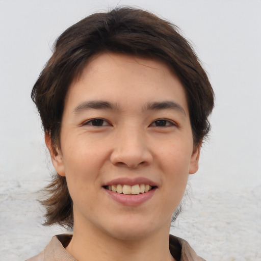 Joyful white young-adult male with medium  brown hair and brown eyes