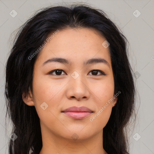 Joyful latino young-adult female with long  brown hair and brown eyes