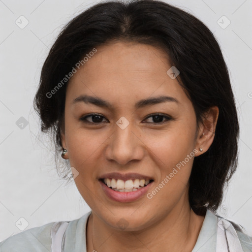 Joyful latino young-adult female with medium  brown hair and brown eyes