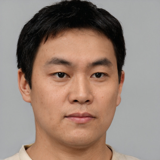 Neutral asian young-adult male with short  black hair and brown eyes