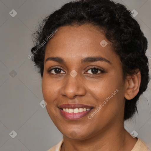 Joyful black young-adult female with medium  brown hair and brown eyes