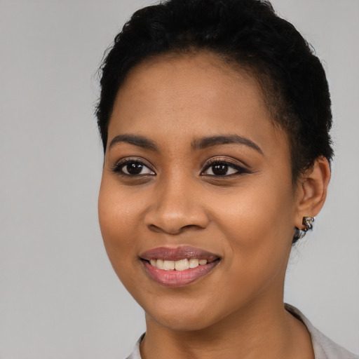 Joyful latino young-adult female with short  black hair and brown eyes