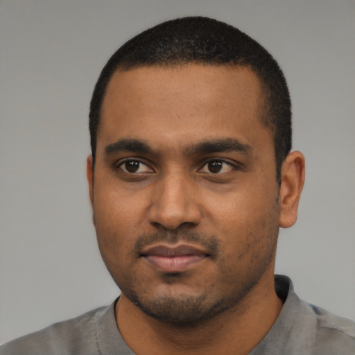 Neutral black young-adult male with short  black hair and brown eyes