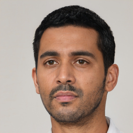 Neutral latino young-adult male with short  black hair and brown eyes