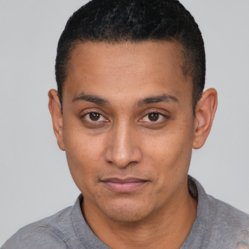 Neutral latino young-adult male with short  black hair and brown eyes