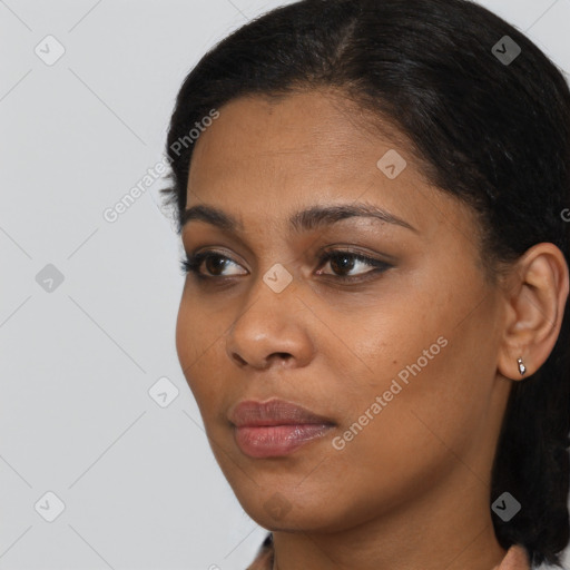 Neutral black young-adult female with short  black hair and brown eyes