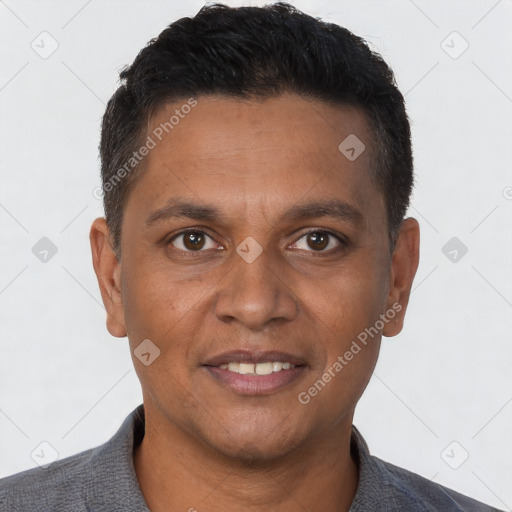 Joyful white adult male with short  brown hair and brown eyes