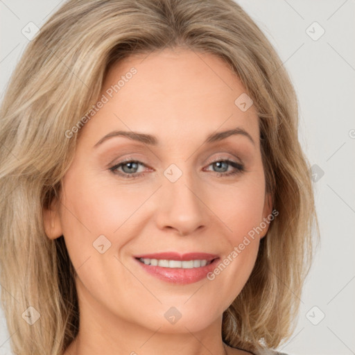 Joyful white adult female with long  brown hair and grey eyes