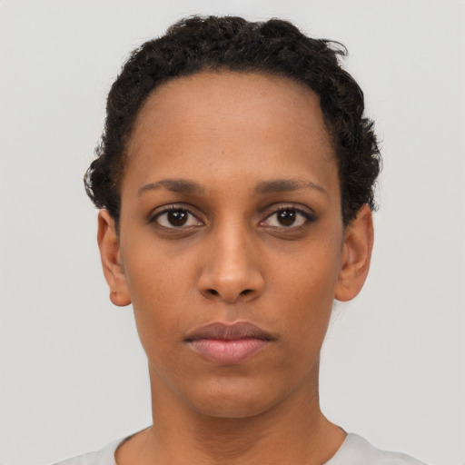 Neutral black young-adult female with short  black hair and brown eyes