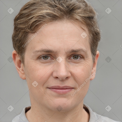 Joyful white adult female with short  brown hair and grey eyes