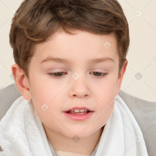 Joyful white child male with short  brown hair and brown eyes