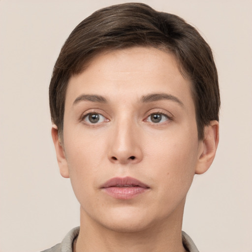 Neutral white young-adult female with short  brown hair and brown eyes