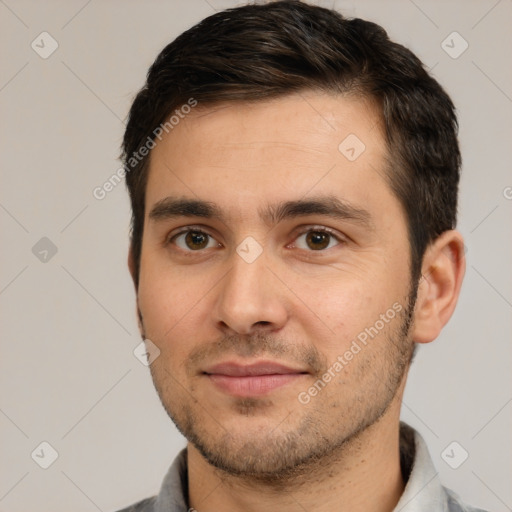 Joyful white young-adult male with short  brown hair and brown eyes