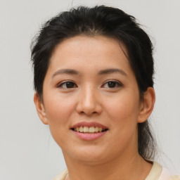 Joyful asian young-adult female with short  brown hair and brown eyes