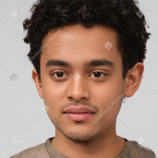 Neutral latino young-adult male with short  brown hair and brown eyes