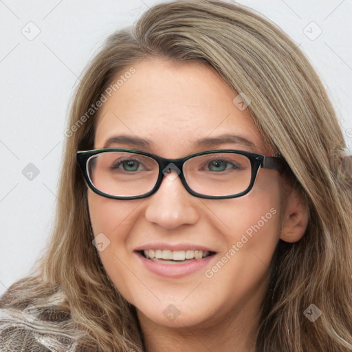 Joyful white young-adult female with long  brown hair and blue eyes