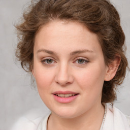 Joyful white young-adult female with medium  brown hair and green eyes