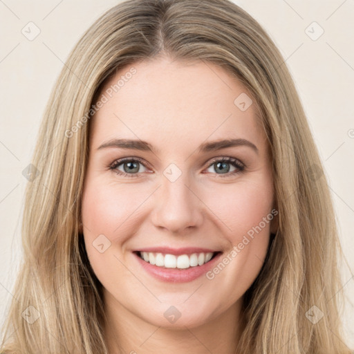 Joyful white young-adult female with long  brown hair and green eyes