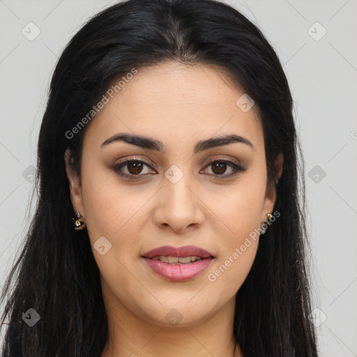 Joyful latino young-adult female with long  brown hair and brown eyes