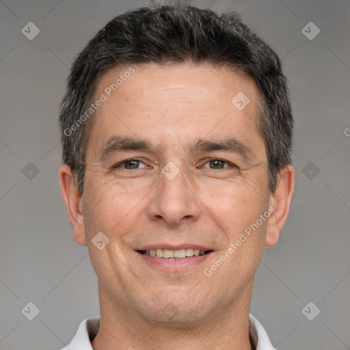 Joyful white adult male with short  brown hair and brown eyes