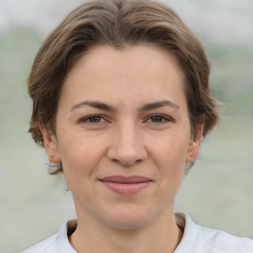 Joyful white adult female with short  brown hair and brown eyes