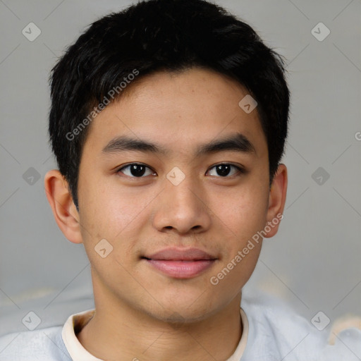 Joyful asian young-adult male with short  black hair and brown eyes