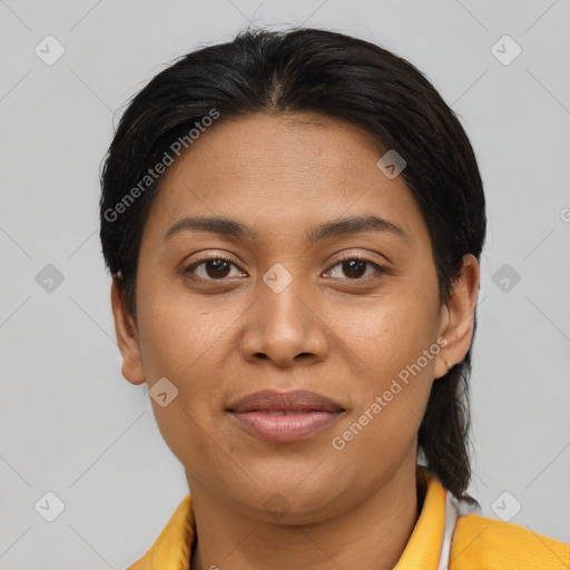 Joyful latino young-adult female with short  brown hair and brown eyes